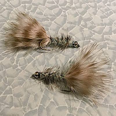Grey Wooly bugger streamer for trout fly fishing